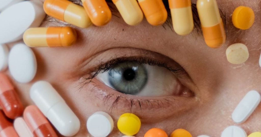 A child's face covered with tablets